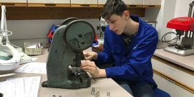 Apprentice Adam assembling components at APT