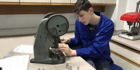 Apprentice Adam assembling components at APT